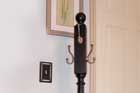 a brand new coat rack in a hallway setting