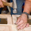 Tom Silva attaching a lattice strip to the joined cabinets