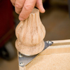 Tom Silva screwing feet into the foot plates