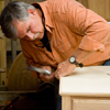 Tom Silva adding the trim to the top of the sideboard