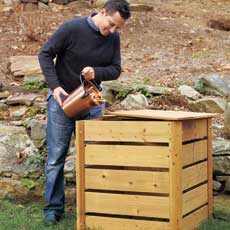 man pouring compost into his compost bin