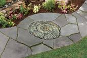a finished spiral-shaped pebble mosaic