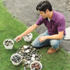 Mark Powers sorting stones in buckets