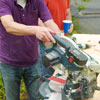 Man cutting jig pieces 