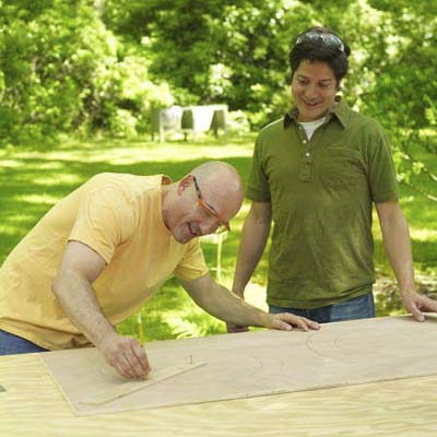 two men preparing materials to make shishkaball game