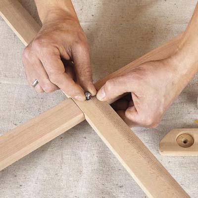 Mark Powers attaches the sides of the bar cart