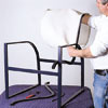 man sliding new chair sling onto chair frame