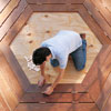 Mark Powers arranges the bench pieces to form a hexagon