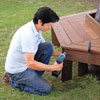 Mark Powers attaches the tree bench apron