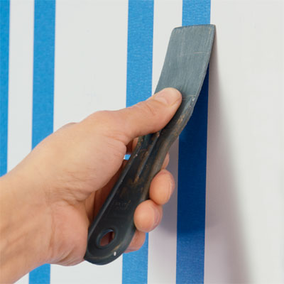 seal the tape in order to paint a striped wall