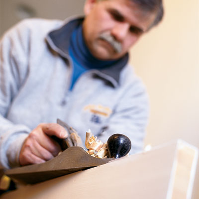 this old house general contractor tom silva shaves a door using a hand plane
