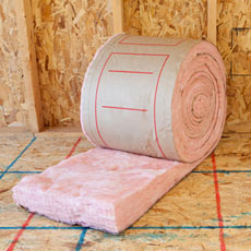 room with roll of insulation batting and tools