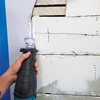 man using reciprocating saw to remove lath and plaster for wall niche installation