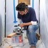 man sizing blocking for wall niche installation