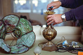hands rewiring a lamp