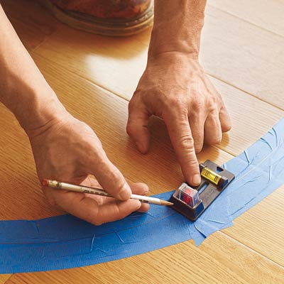 using a magnetic nail finder to find the flooring nails