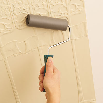 using a smoothing roller to the Lincrusta wainscot panel to minimize air bubbles