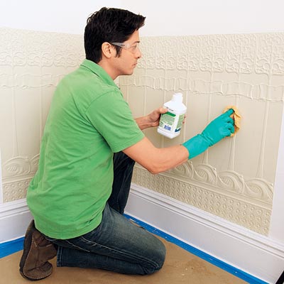 applying mineral spirits to the installed Lincrusta wainscot panels in order to clean it before painting
