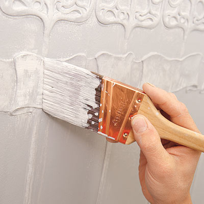 adding highlights to the painted Lincrusta wainscot panels with a dry brush