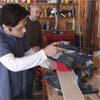using a miter saw to cut the apron pieces and cleats for building a display coffee table