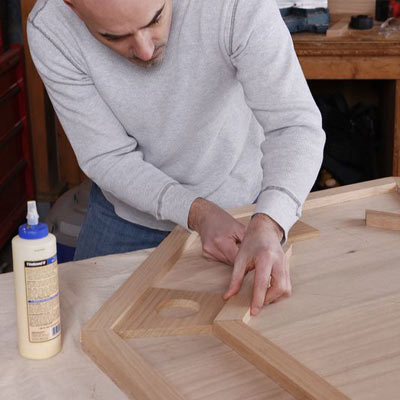 man installing inner edge of poker table