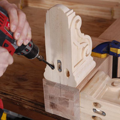 man attaching feet to poker table