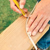 marking the tail profile on the rafter board with a pencil
