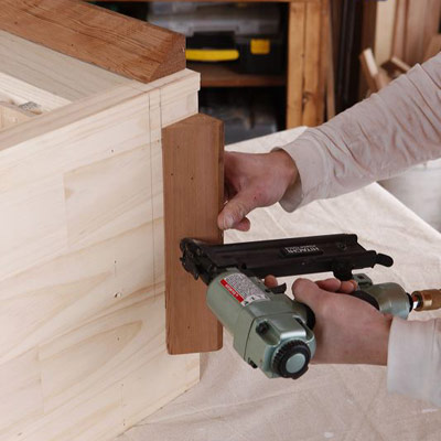 Install the baseboard molding to make a wine hutch