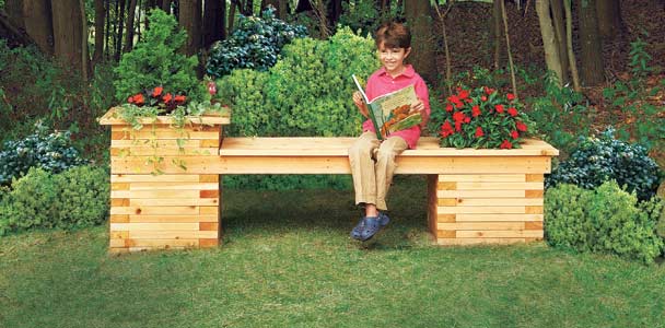 child enjoying a seat on an outdoor planter bench on a beautiful day
