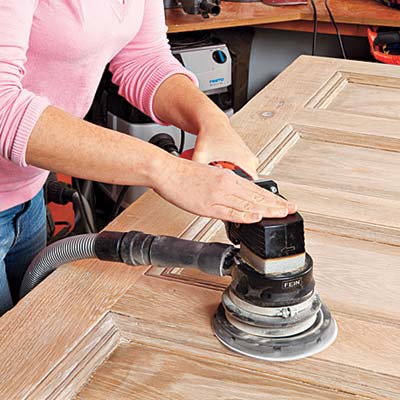 sanding a repurposed door surface