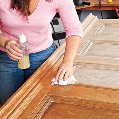 applying a furniture polish to the door/headboard