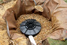 filling up the hole around the dry-well with rounded stones