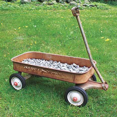 line the wagon with gravel to make a herb planter on wheels