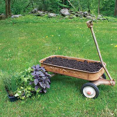 add potting soil and pant herbs to make a herb planter on wheels