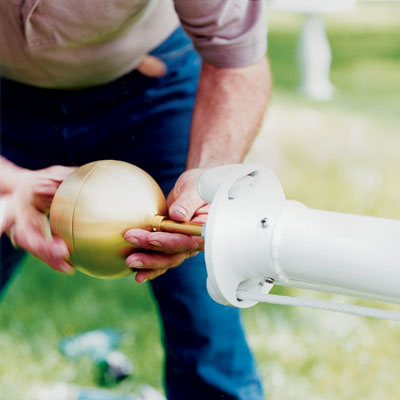 attach the finial to install an in-ground flagpole