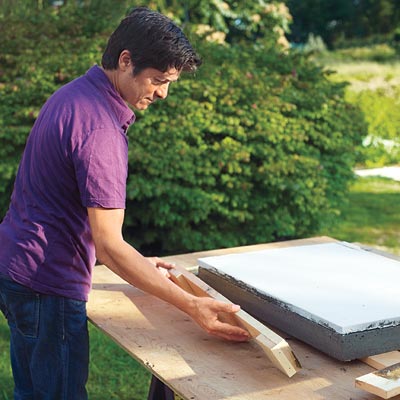 Mark Powers removes the frame for the hypertufa tabletop