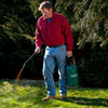 Roger Cook sprays compost tea on a lawn with a pump sprayer