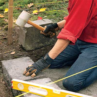 lay the first course to build a stone planter