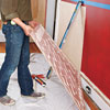 fixing the wainscoting panel to the wall