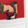 nailing the chair rail into place