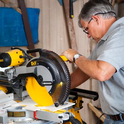 Tom Silva cuts strips for the front bottle insert with a miter saw