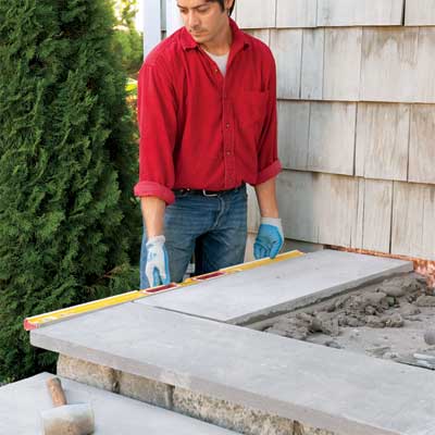 install the perimeter treads to clad concrete steps in stone