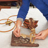 securing the top of an old barn pulley to a wall bracket