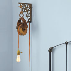 a lighting fixture that uses a barn pulley and a clothesline pulley
