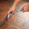 applying the vinyl flooring patch to the patch area with a J-roller