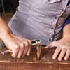 secure the straps to build a table from salvage beams