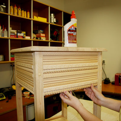 attaching the trim to the side table apron