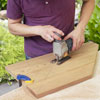cutting away the back legs of a Westport chair with a jigsaw