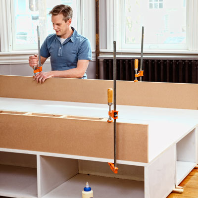 clamping together the MDF panels for the bed frame of a storage bed