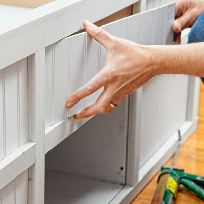 installing the paneling for a storage bed